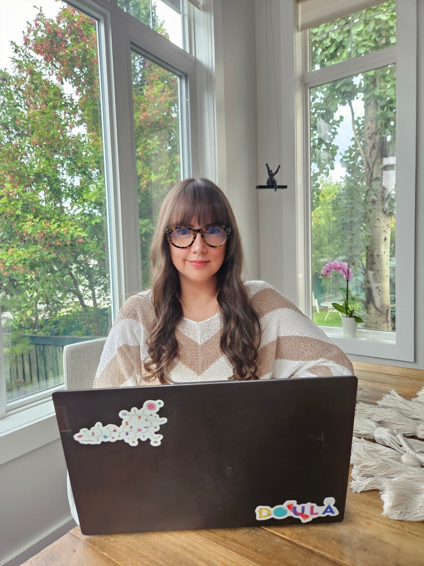 Vero at her laptop, ready for an online childbirth education session.